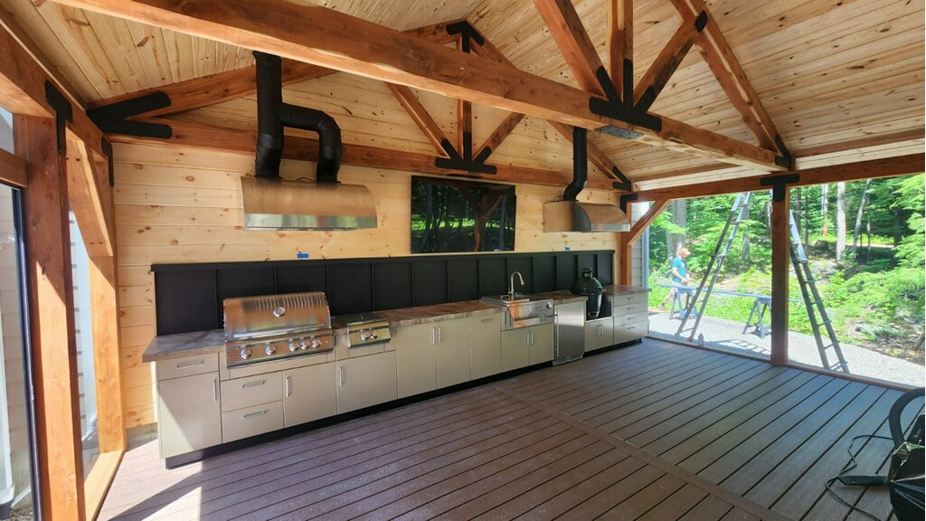 Heavy timber outdoor kitchen with composite decking