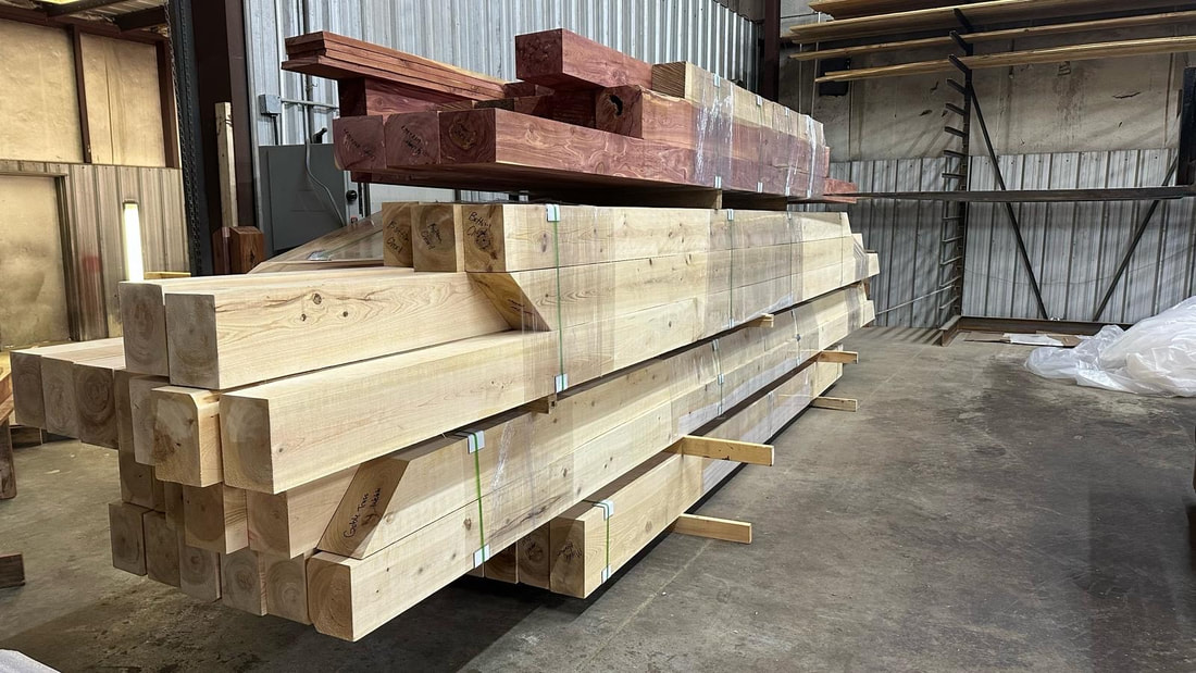 Stacks of milled Cypress, Cedar, and Southern Yellow Pine timbers in our shop